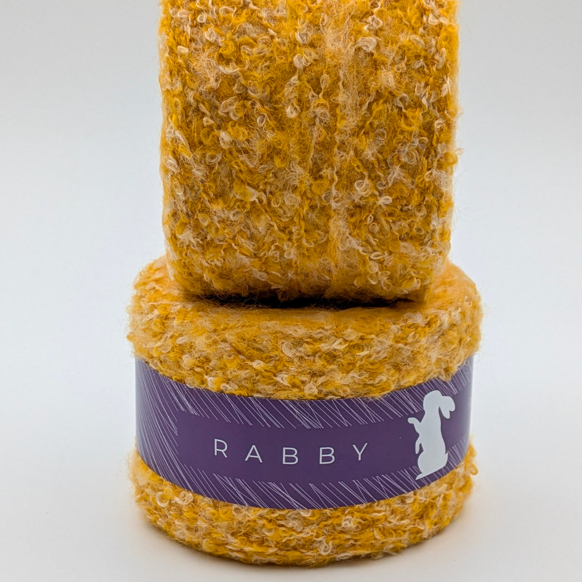 Bouclé Garn Crown mit Wolle in Gelb – RABBY, weitere Ansicht
