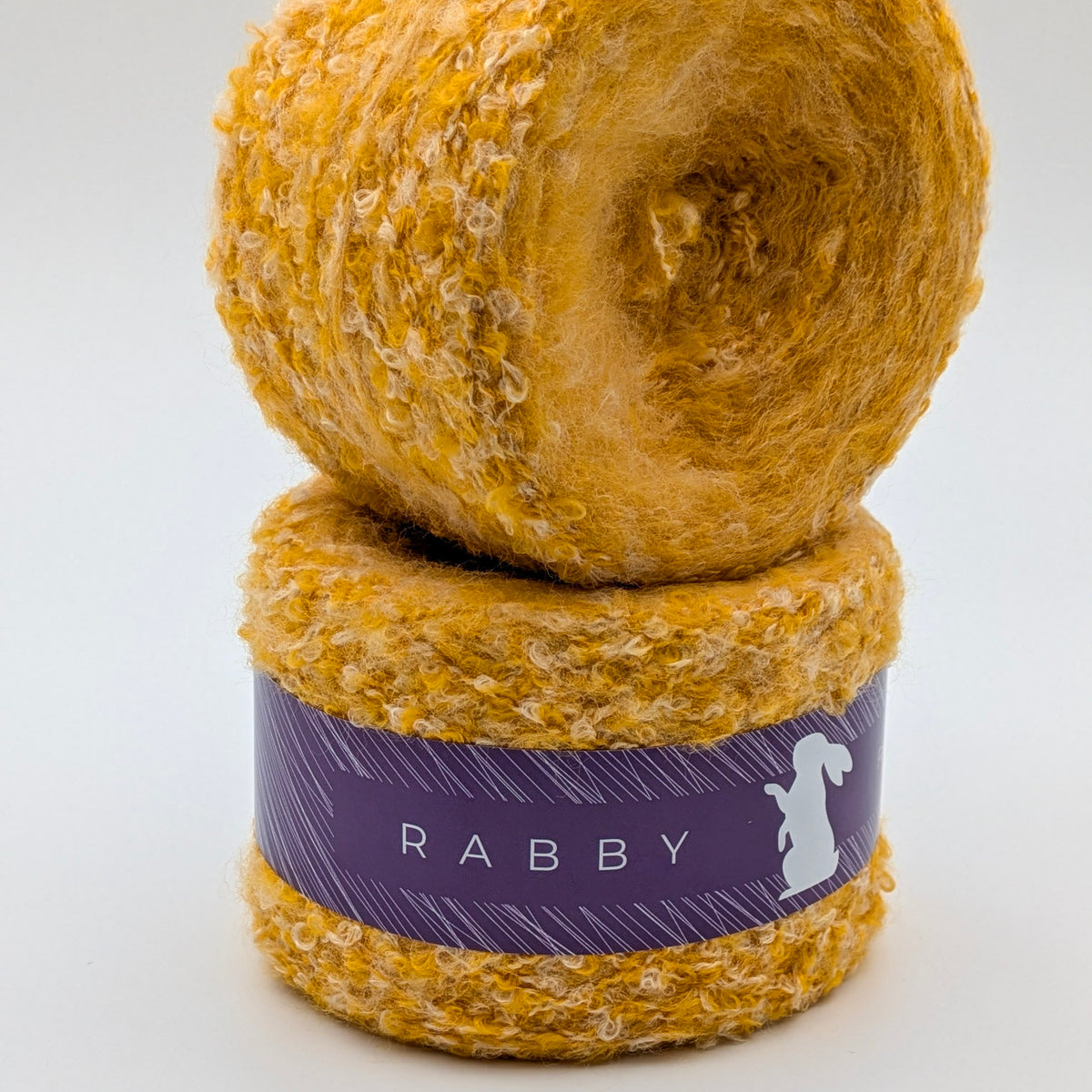 Bouclé Garn Crown mit Wolle in Gelb – RABBY, weitere Ansicht