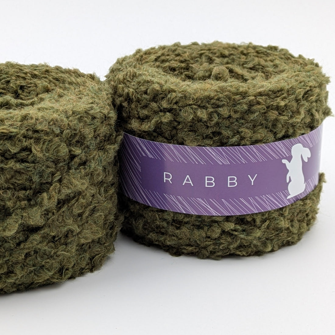 Bouclé Garn Cuma mit Wolle in Olivgrün – RABBY, weitere Ansicht